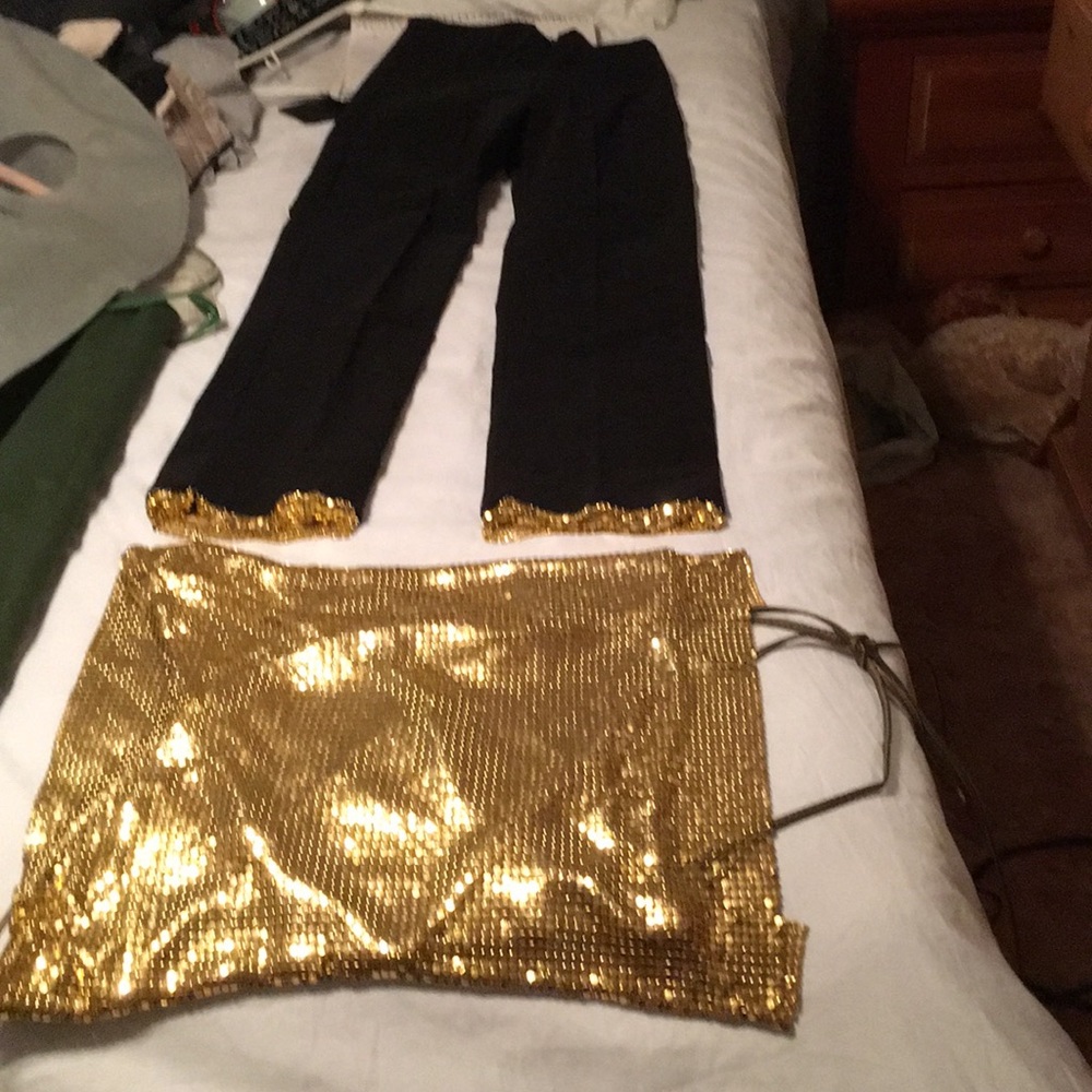 Black and gold outfit.
